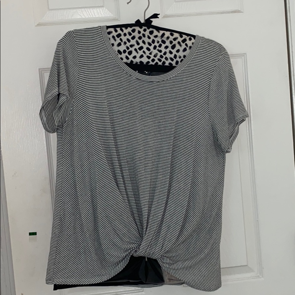 large striped shirt with knot tied up at bottom